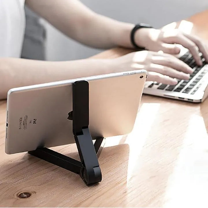 Black foldable tablet holder showing adjustable angles and rubber surface for device protection