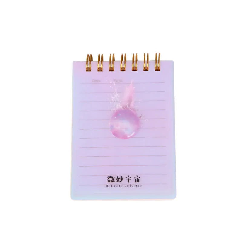 A7 spiral-bound rollover coil pocket notepad in one of four colour series, showing its compact size and binding.