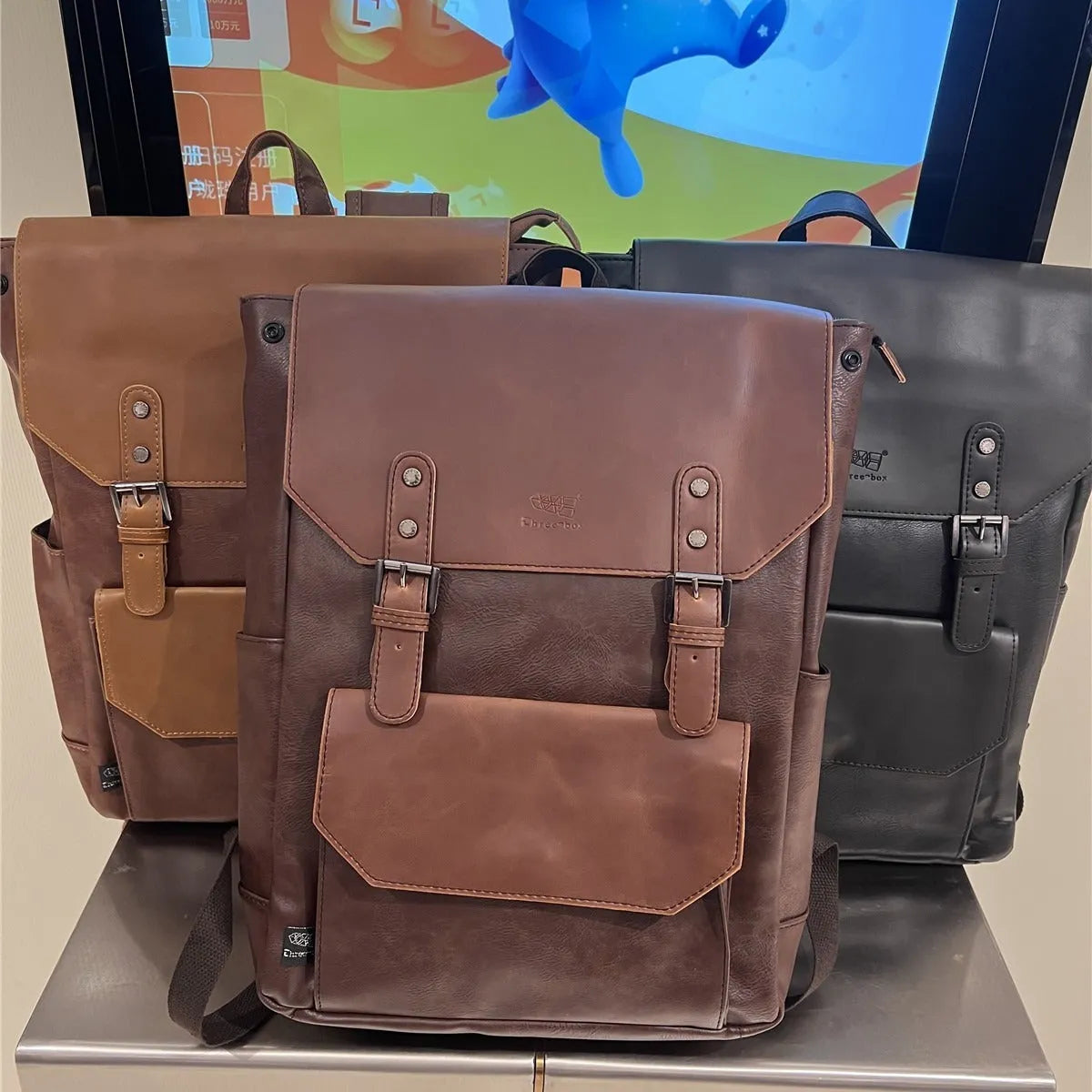 Unisex large capacity backpack in breathable PU material suitable for business travel and college use