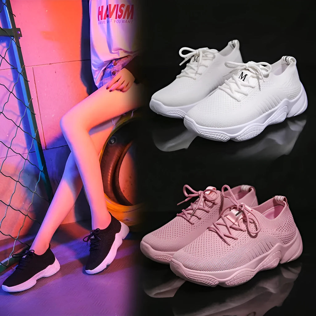 Women's white thick-soled flying woven trainers with pink perforations and a front strap on a rubber sole.