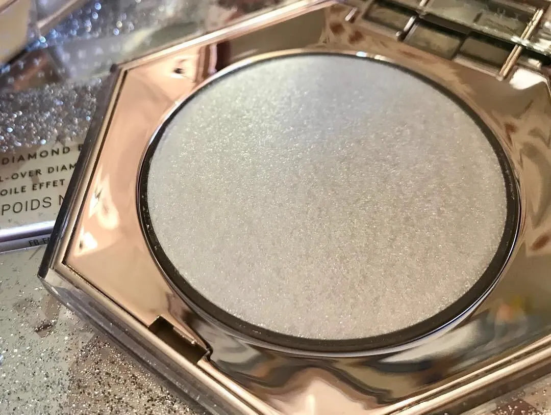 Fenty Beauty Diamond Bomb high gloss powder in compact with diamond-cut packaging