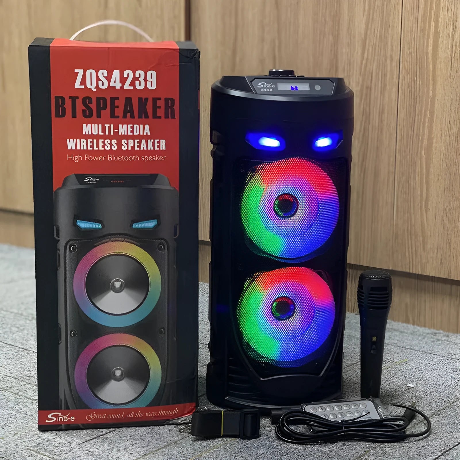 Black portable Bluetooth speaker with dual horn design and wheat detailing, showing USB port and card slot