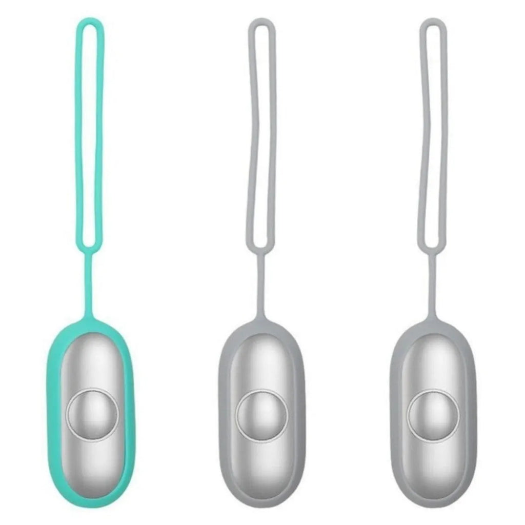 Handheld microcurrent sleep aid device with round control button in grey, green, or orange colours