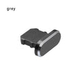 Aluminum alloy iPhone charging port dust plug in rose gold colour on a grey background.