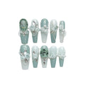Green armour coloured full nail set with Camellia flower gradient chain, bow, and butterfly designs.
