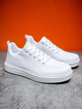 White casual sports shoes with thick EVA sole and mesh upper, flat heel, round toe, front lace-up closure