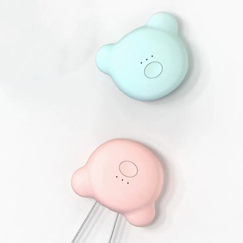 Mini USB rechargeable air purifier necklace in blue, shown with charging cable.