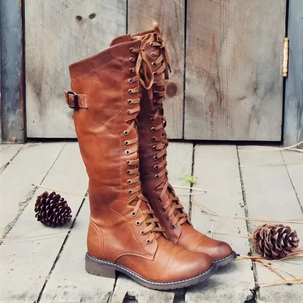 Black women's chunky heel high-leg casual boots with a round toe on a plain background.