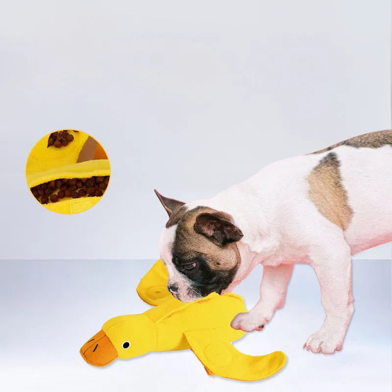 Yellow teddy dog toy with duck sound mechanism and food leak holes for treat dispensing