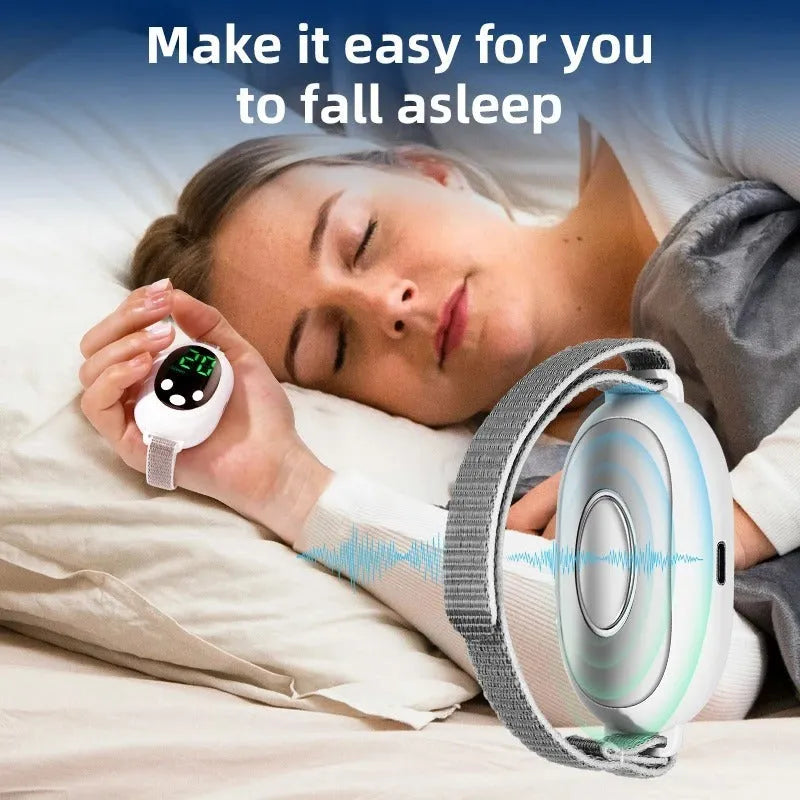 White insomnia help device with sleep bracelet, handheld remote control, and USB charging cable