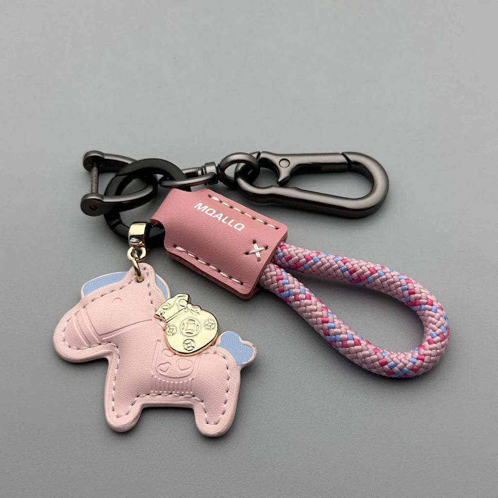 Handmade brown cowhide leather keychain with a silver pony belt buckle charm and green velvet rope.