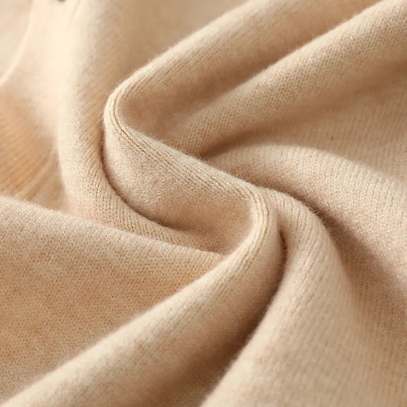 Man wearing a beige V-neck Andy velvet cardigan coat with long sleeves