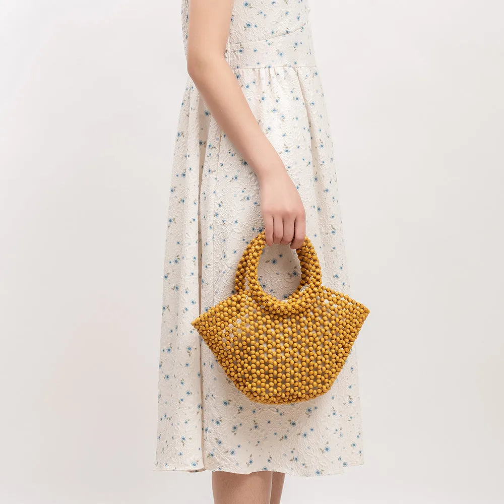 Maple wood hand-woven seaside handbag with wooden beads in dumpling shape