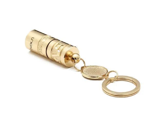 Gold-coloured zinc alloy die-cast LED keychain flashlight with attached key ring.