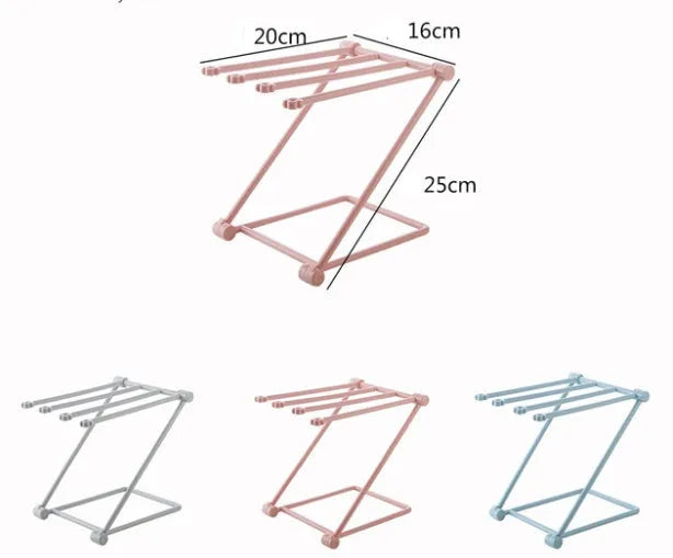 Light grey foldable plastic dishcloth shelf on a kitchen countertop