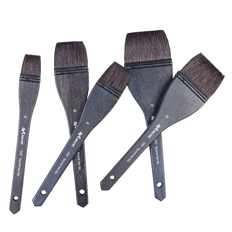Set of five grey squirrel hair makeup brushes with wooden handles in different sizes from 30mm to 70mm wide.