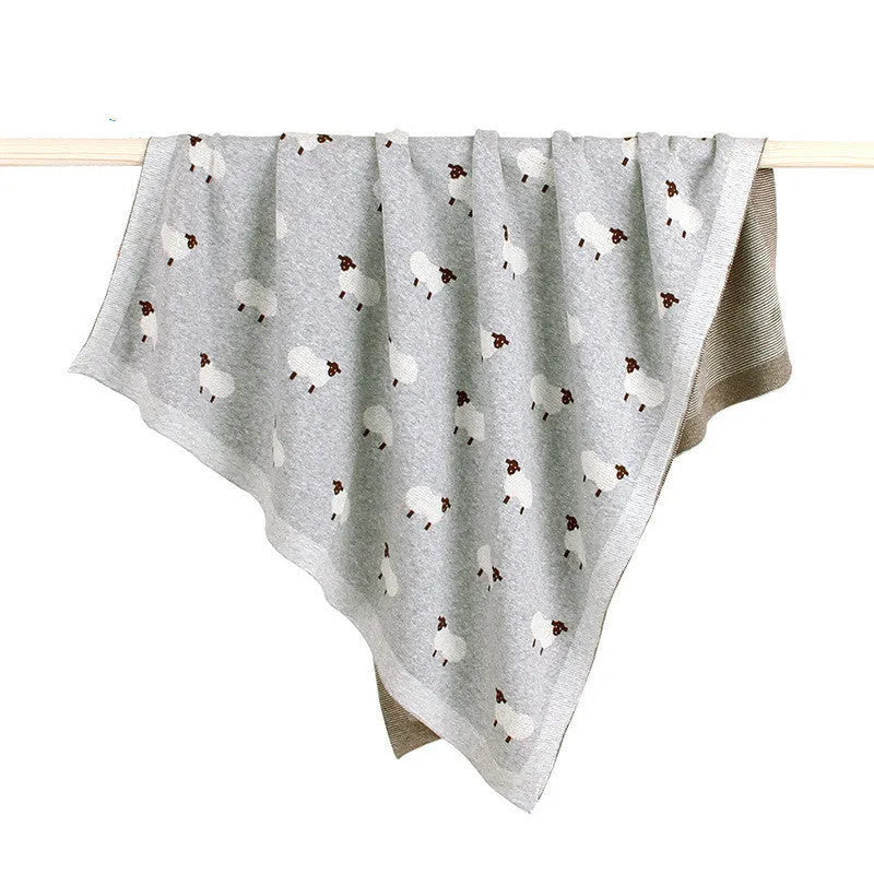 100x80cm grey and pink baby sheepskin blanket made from 100% cotton fabric laid flat.