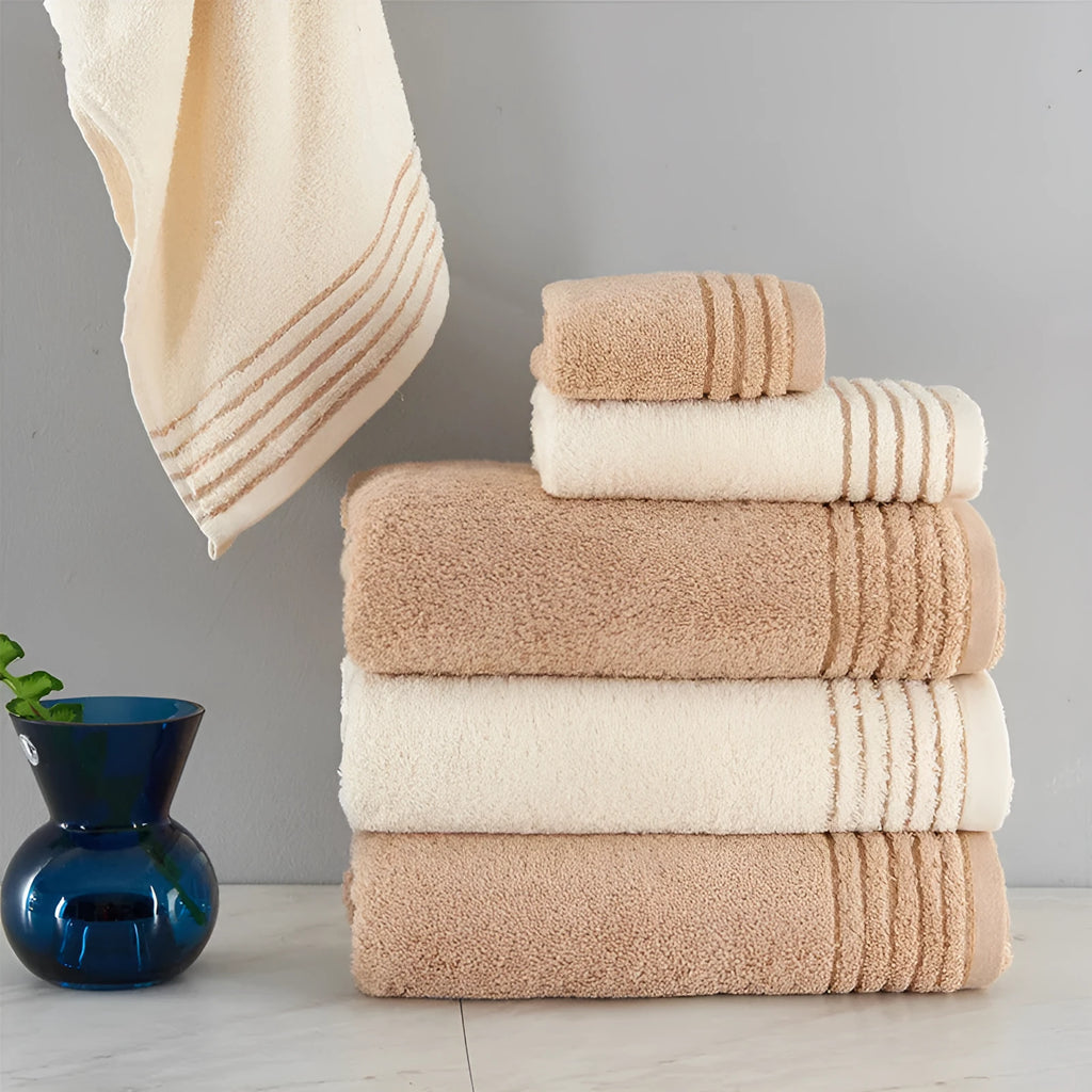 Cotton towel set showing three sizes in beige and brown colours for bathroom use