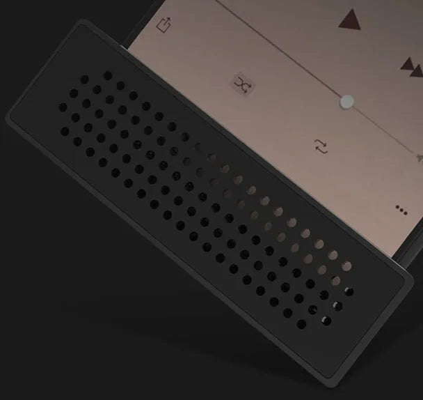 Portable black ABS mobile phone amplifier bracket holding an iPhone on a desk