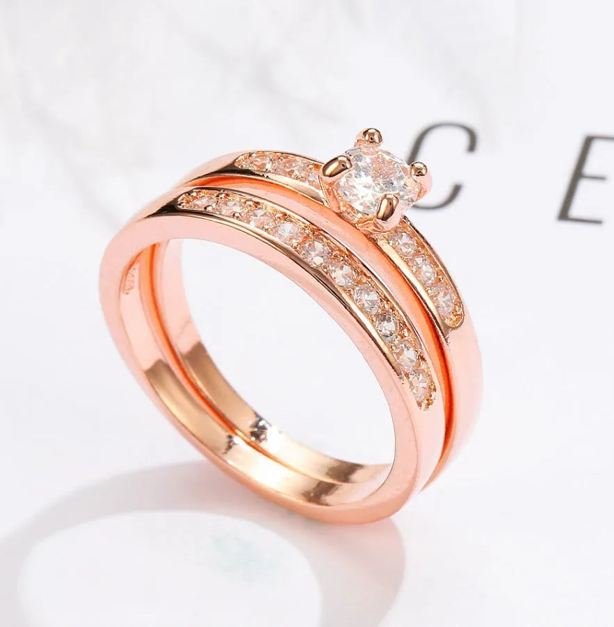 Rose gold ring with diamonds on copper base, available in sizes 5 to 12, shown on a neutral background