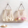 Beige plaid polyester mesh storage bag with cotton rope handles measuring 26x29cm