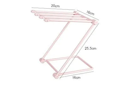 Light grey foldable plastic dishcloth shelf on a kitchen countertop