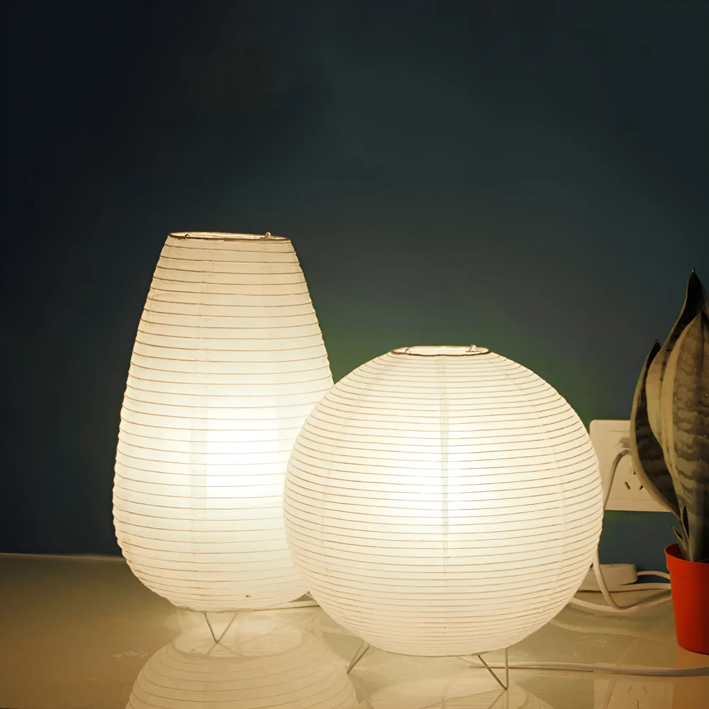 White rice paper plug-in table lamp with traditional shade on wooden surface