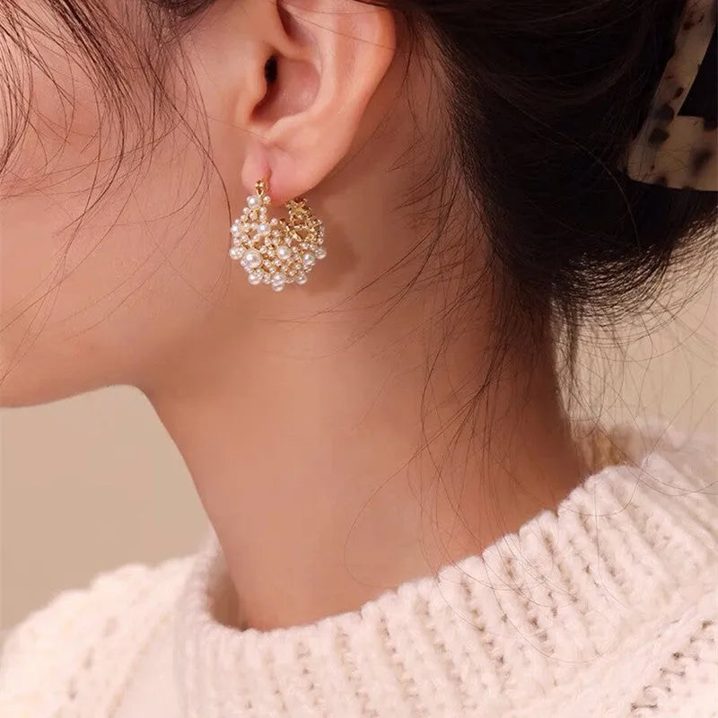 Gold colour women's flower basket earrings with copper construction and rice-shaped bead inlay