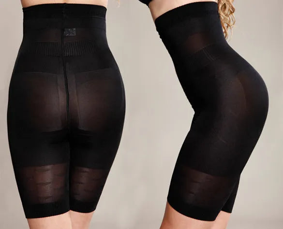 Women's high-waisted seamless shapewear shorts in black on a mannequin, showing tummy control design.