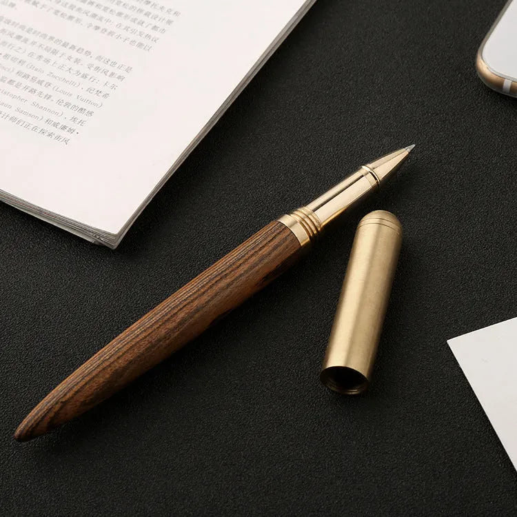 Brass and solid wood signature pen showing wood grain and metal components