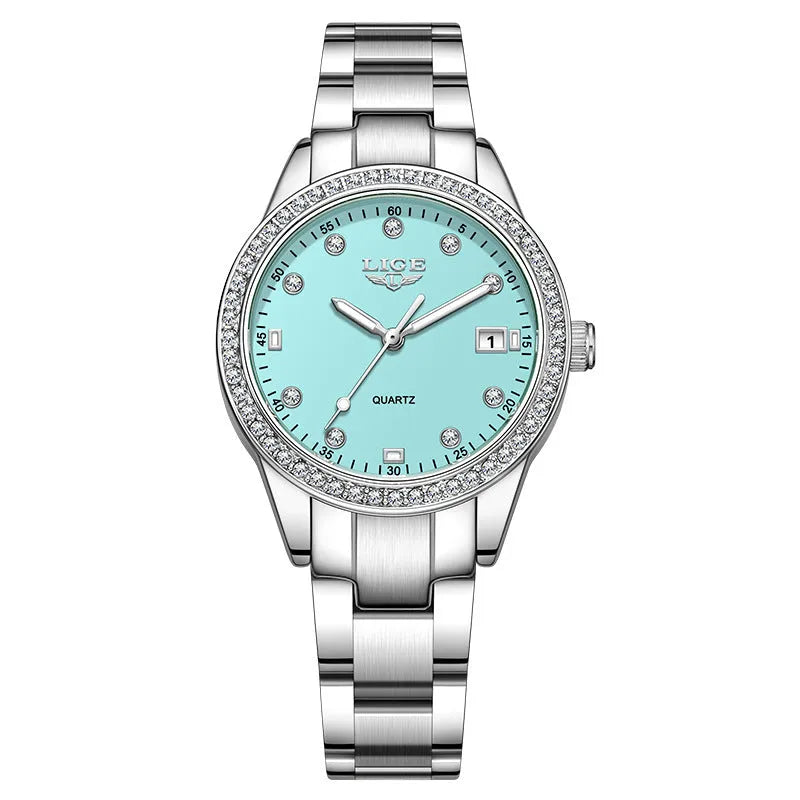 Women's silver fashion watch with diamond bezel, round white dial, luminous hands, and stainless steel bracelet.