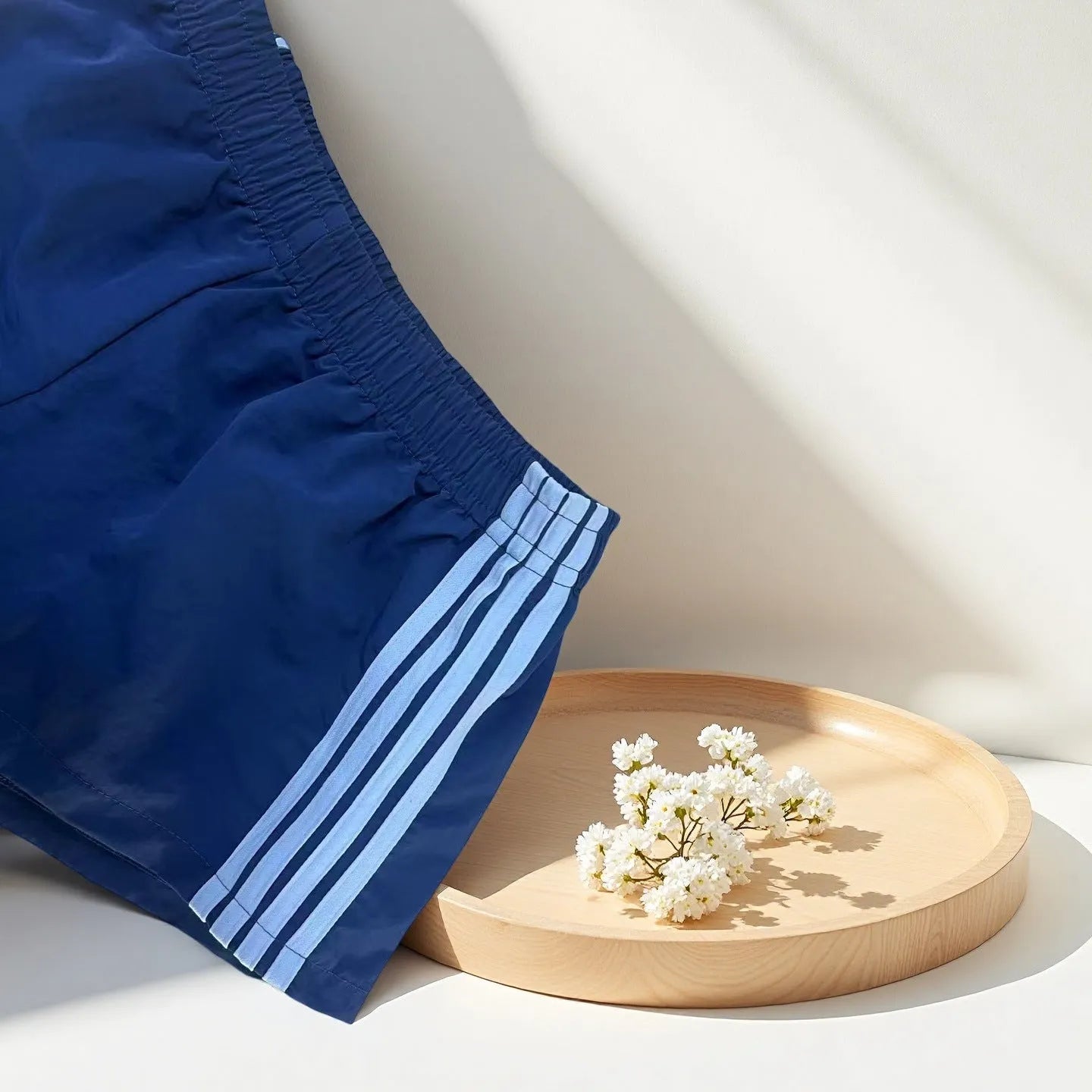 Navy blue men's nylon sport shorts with high-waist elastic waistband