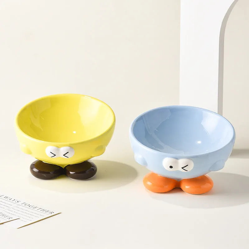 Blue slanted ceramic pet bowl with cute expression design for cat and dog cervical spine support