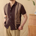 A royal blue striped lapel cardigan polo shirt on a hanger, showing short sleeves and knitted fabric.