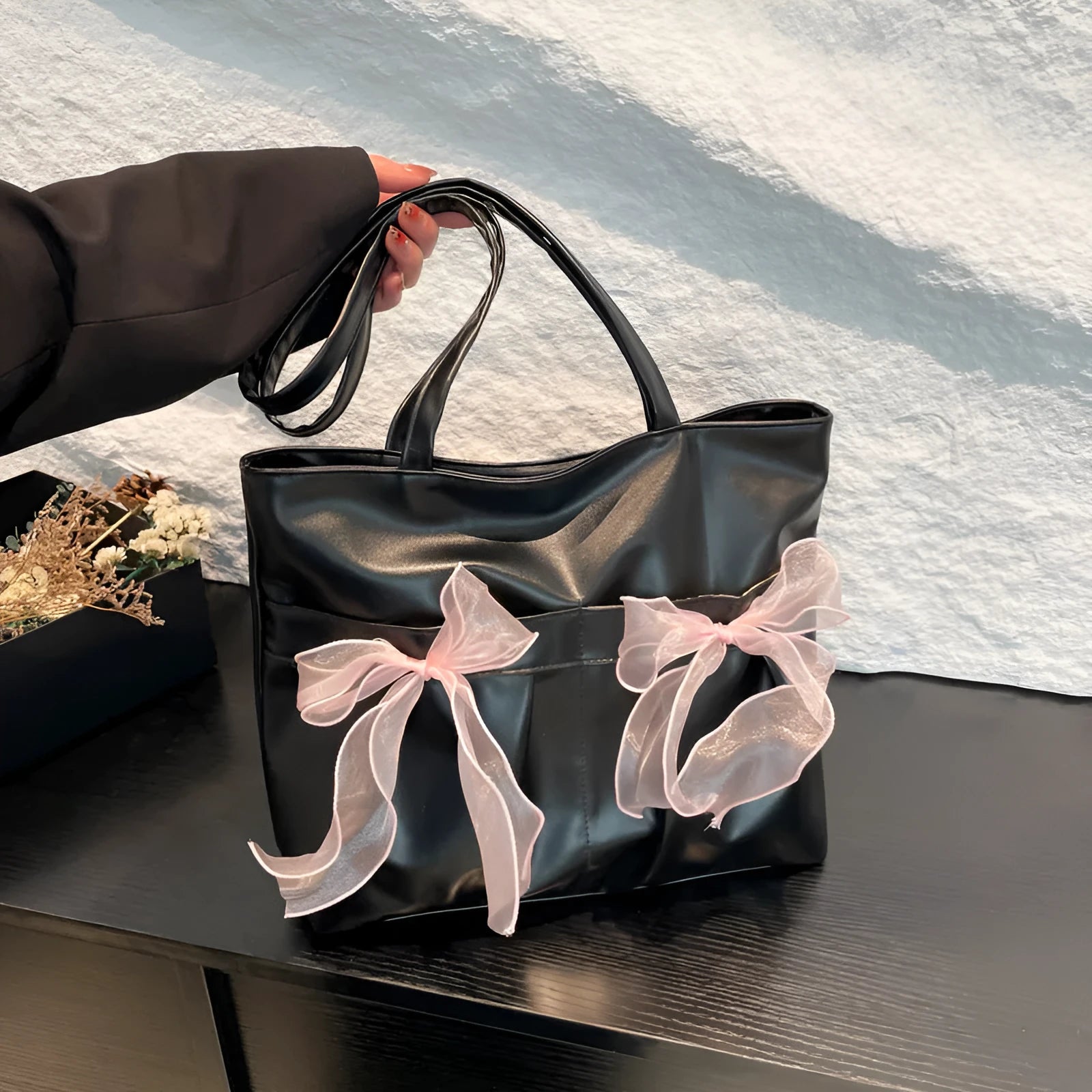 College style bow tote bag with double straps and zippered internal compartment in black colour
