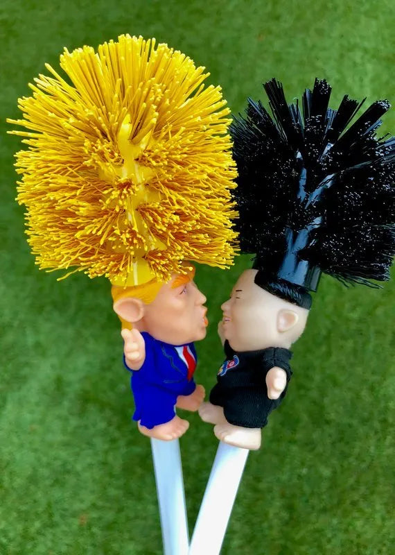 Yellow plastic Donald Trump toilet brush with 40cm length and hanging slot