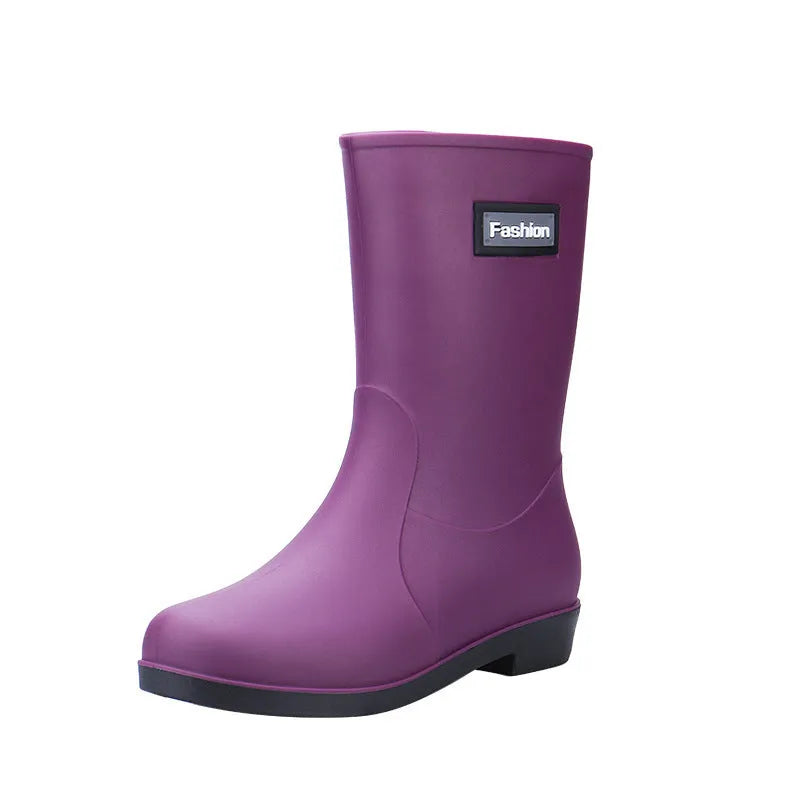 Women's mid-calf PVC rain boots in black, shown with a low heel and optional warm lining.