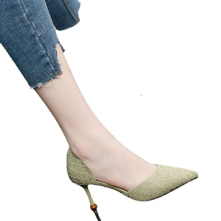 Women's black pointed toe stiletto high heel shoes with a 6-8cm heel on a rubber sole.