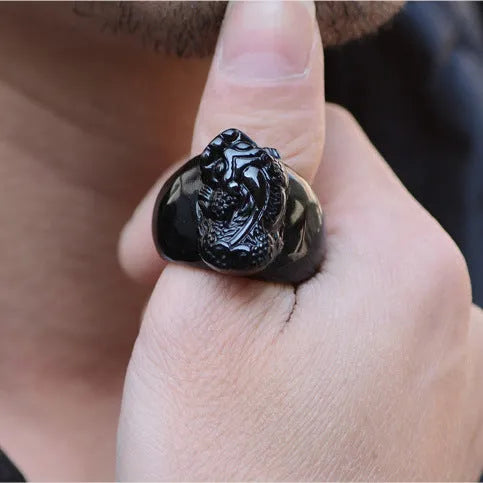 Men's obsidian crystal thumb ring featuring a detailed pixiu carving and a natural gold sheen.