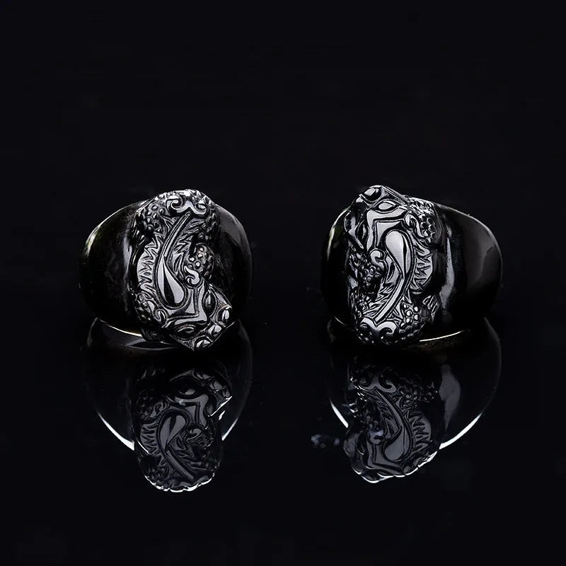Men's obsidian crystal thumb ring featuring a detailed pixiu carving and a natural gold sheen.