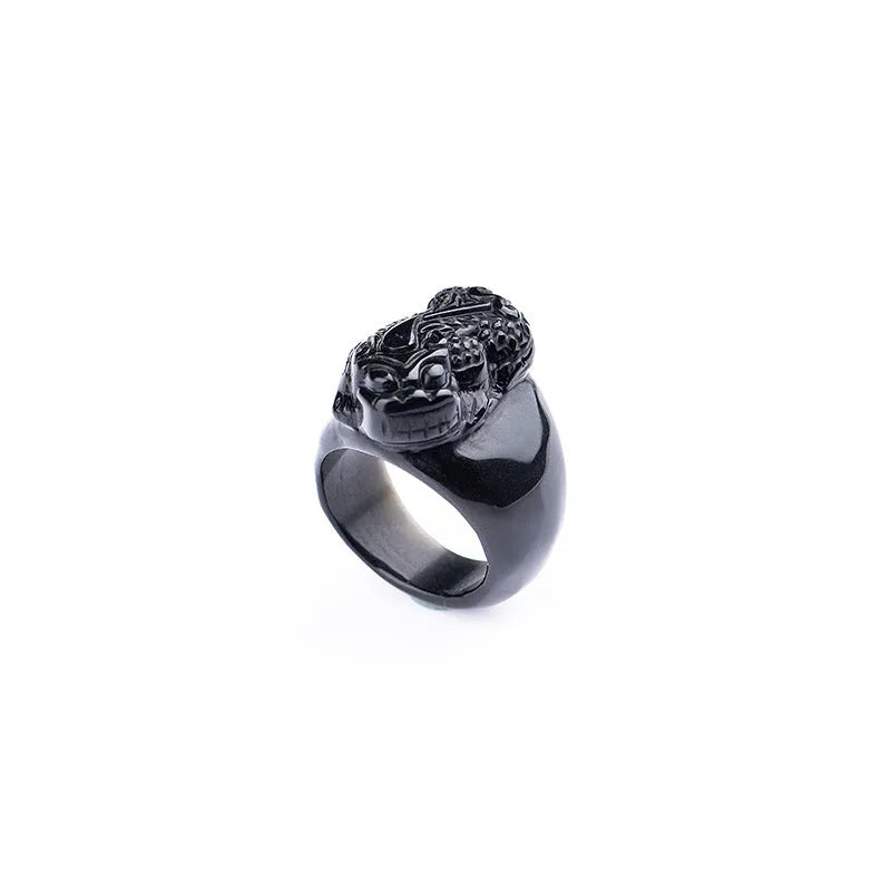 Men's obsidian crystal thumb ring featuring a detailed pixiu carving and a natural gold sheen.