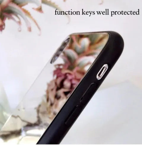 Black iPhone phone case with a built-in circular mirror on the back, shown next to an iPhone.