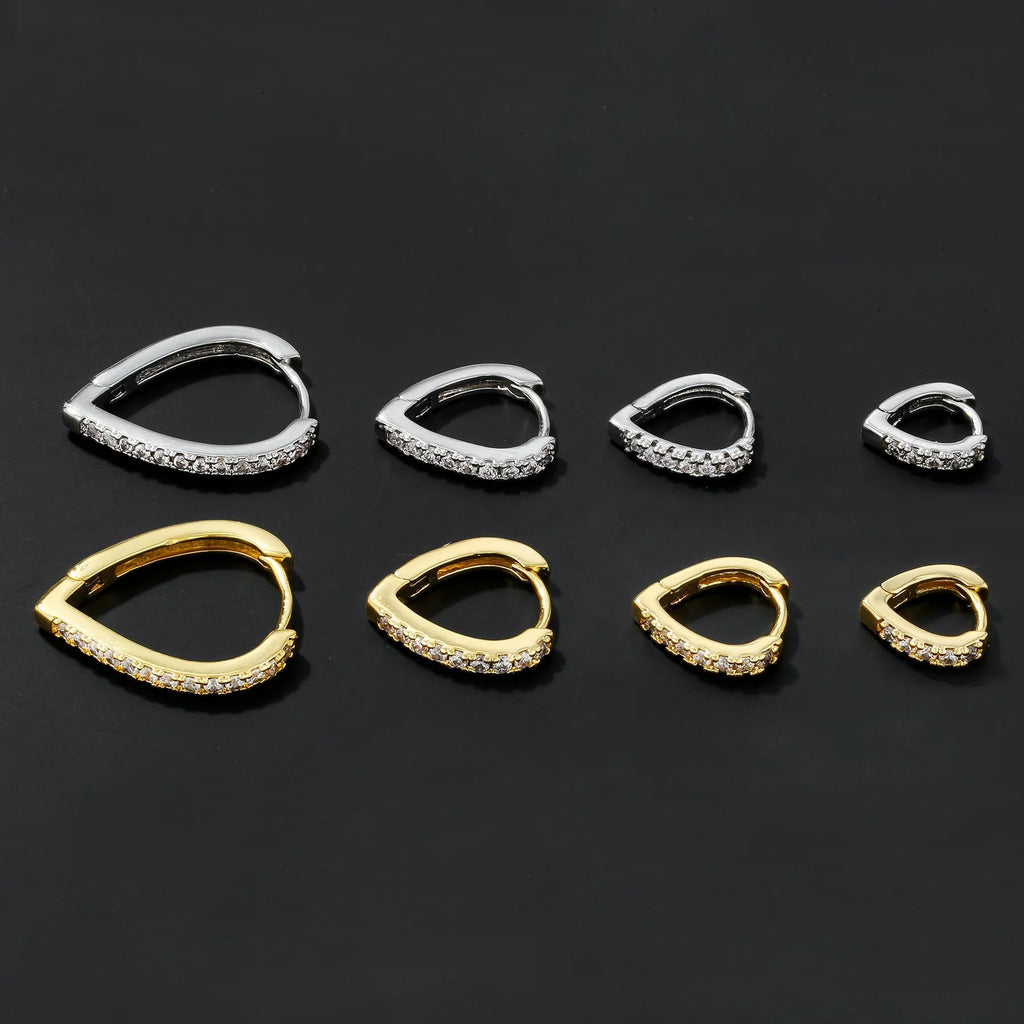 Geometric heart-shaped copper ear clip with electroplated gold finish for women.