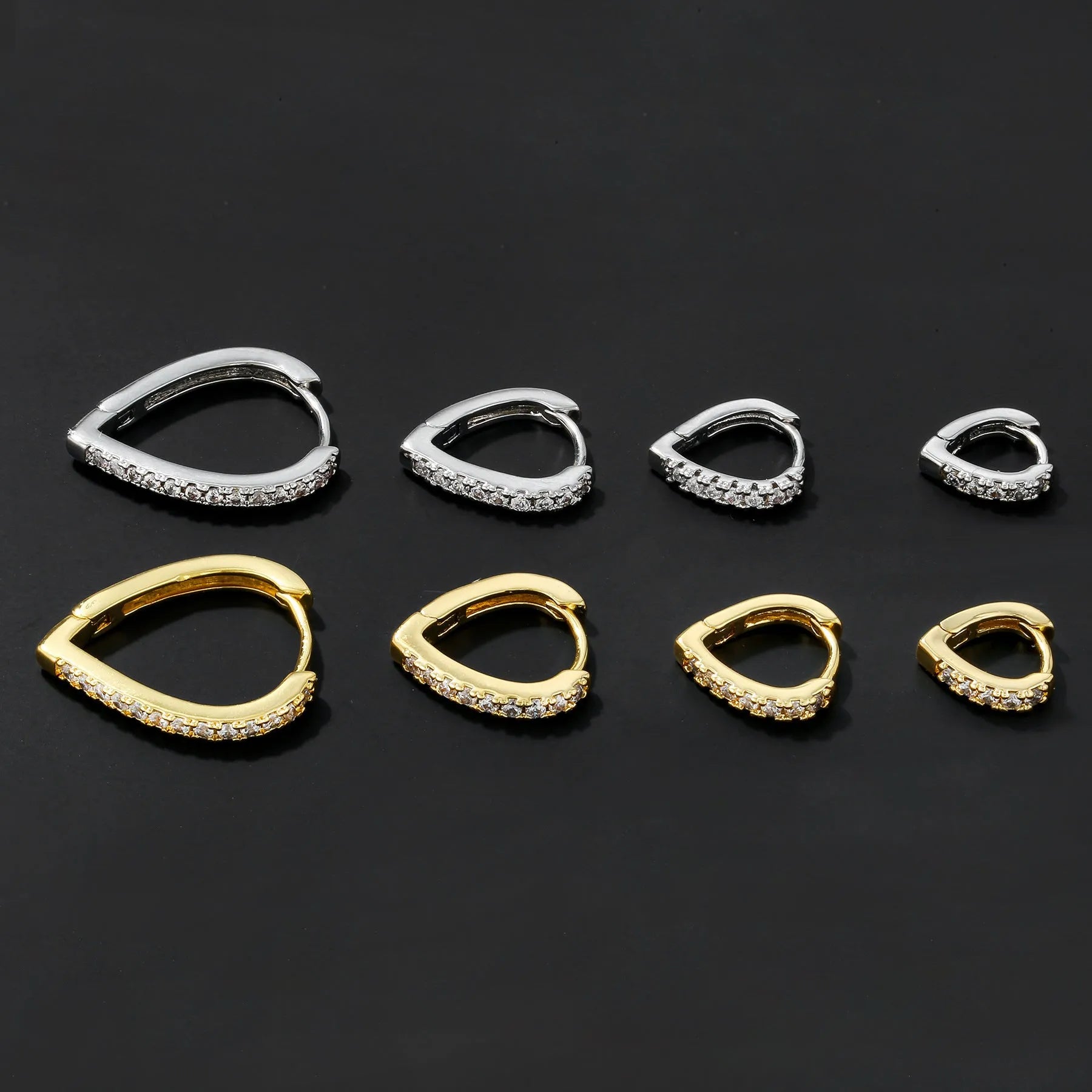 Geometric heart-shaped copper ear clip with electroplated gold finish for women.