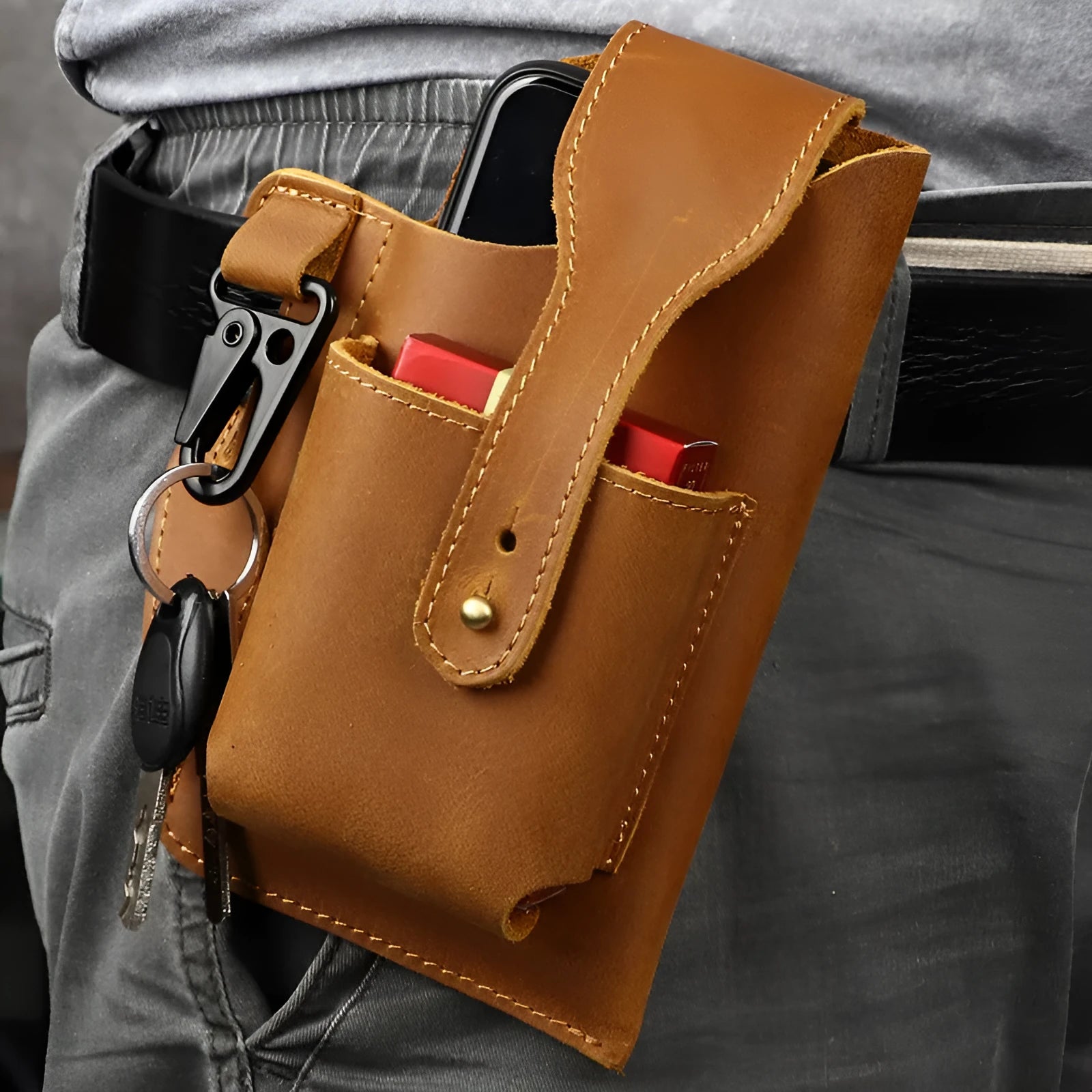 Men's brown leather phone hanging belt bag with car suture stitching showing cover opening and belt attachment