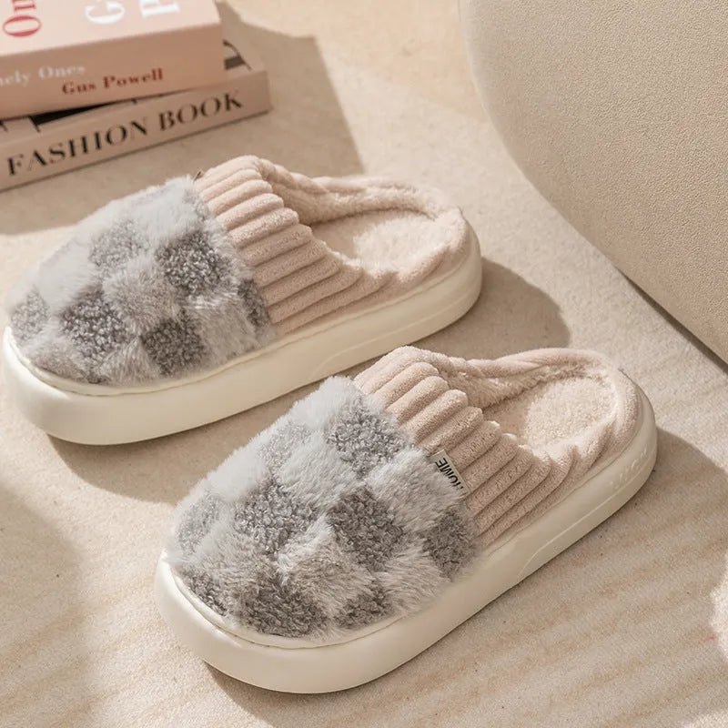 Women's plaid plush slippers in coffee colour with a soft upper, plush lining, and textured PVC sole.