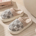 Women's plaid plush slippers in coffee colour with a soft upper, plush lining, and textured PVC sole.