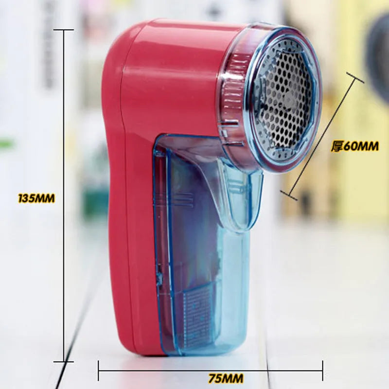 Portable electric lint remover shaver for clothing on a blue background.