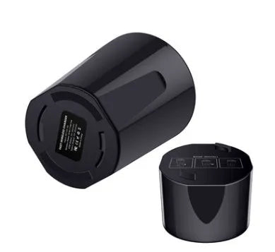 Black X9 car wireless charging cup with detachable base on a car dashboard, showing LED light and phone charging.