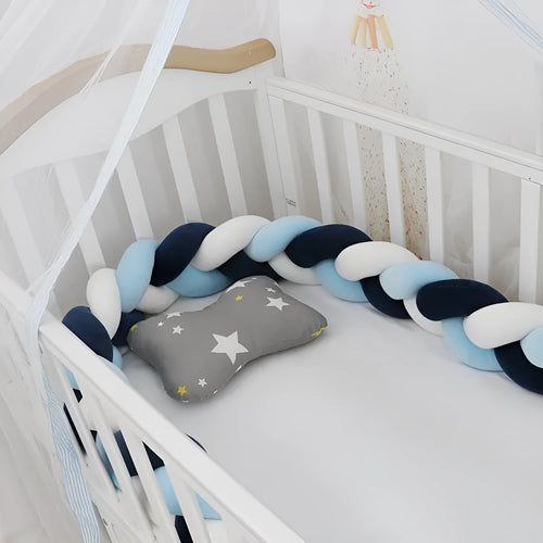 Baby crib bumper protector in spandex velvet, bent to show flexible shape, against a crib rail.